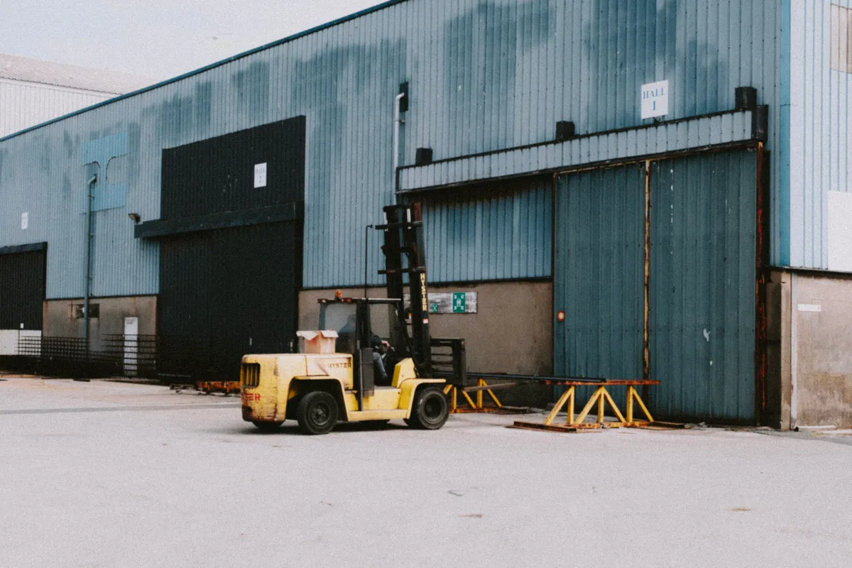 Electric forklift with lithium-ion battery pack in warehouse