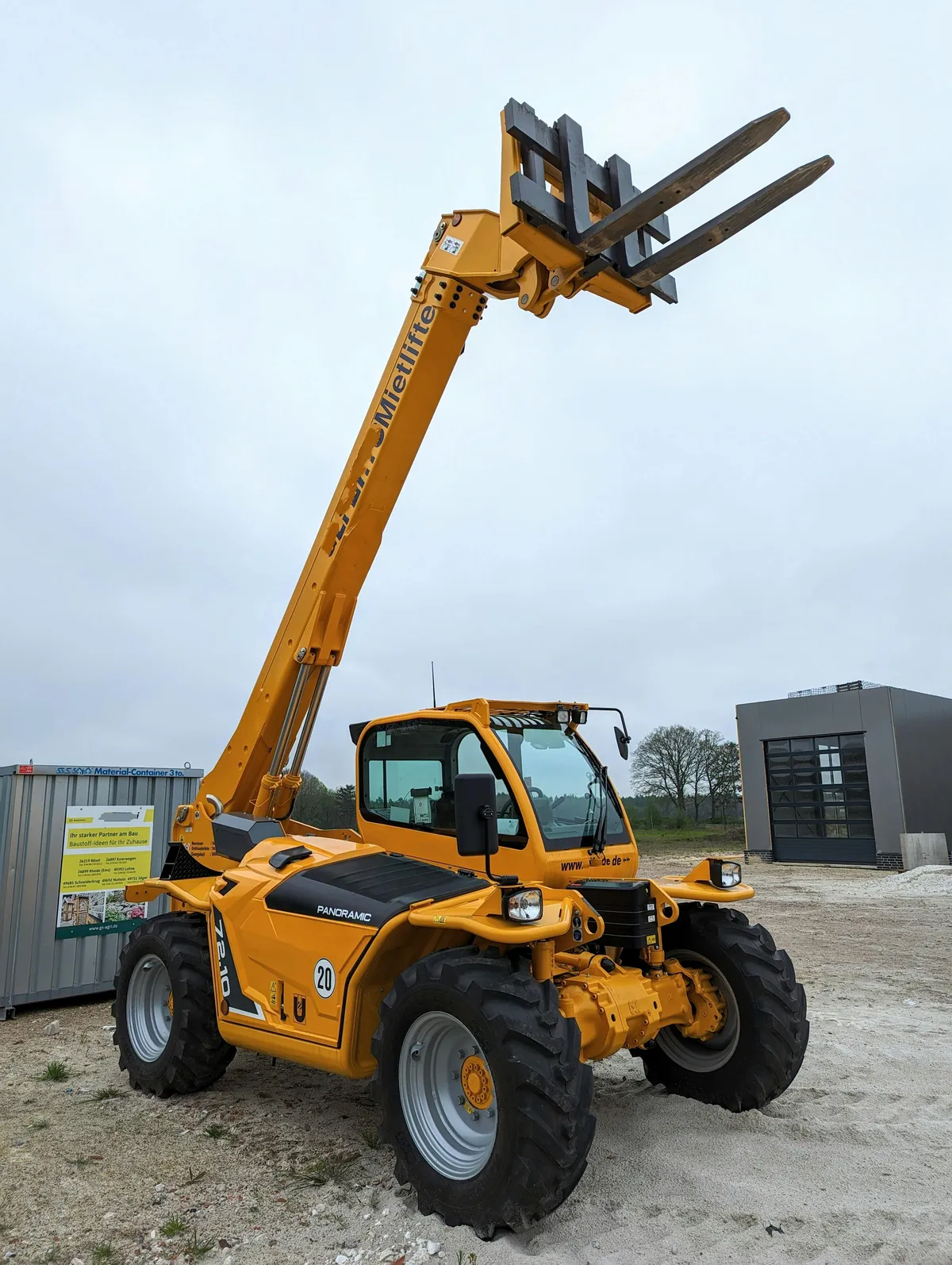 Rough terrain telehandler forklift on outdoor job site