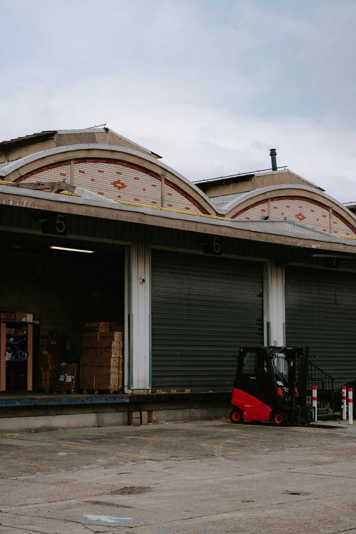 Forklift at warehouse loading dock exterior