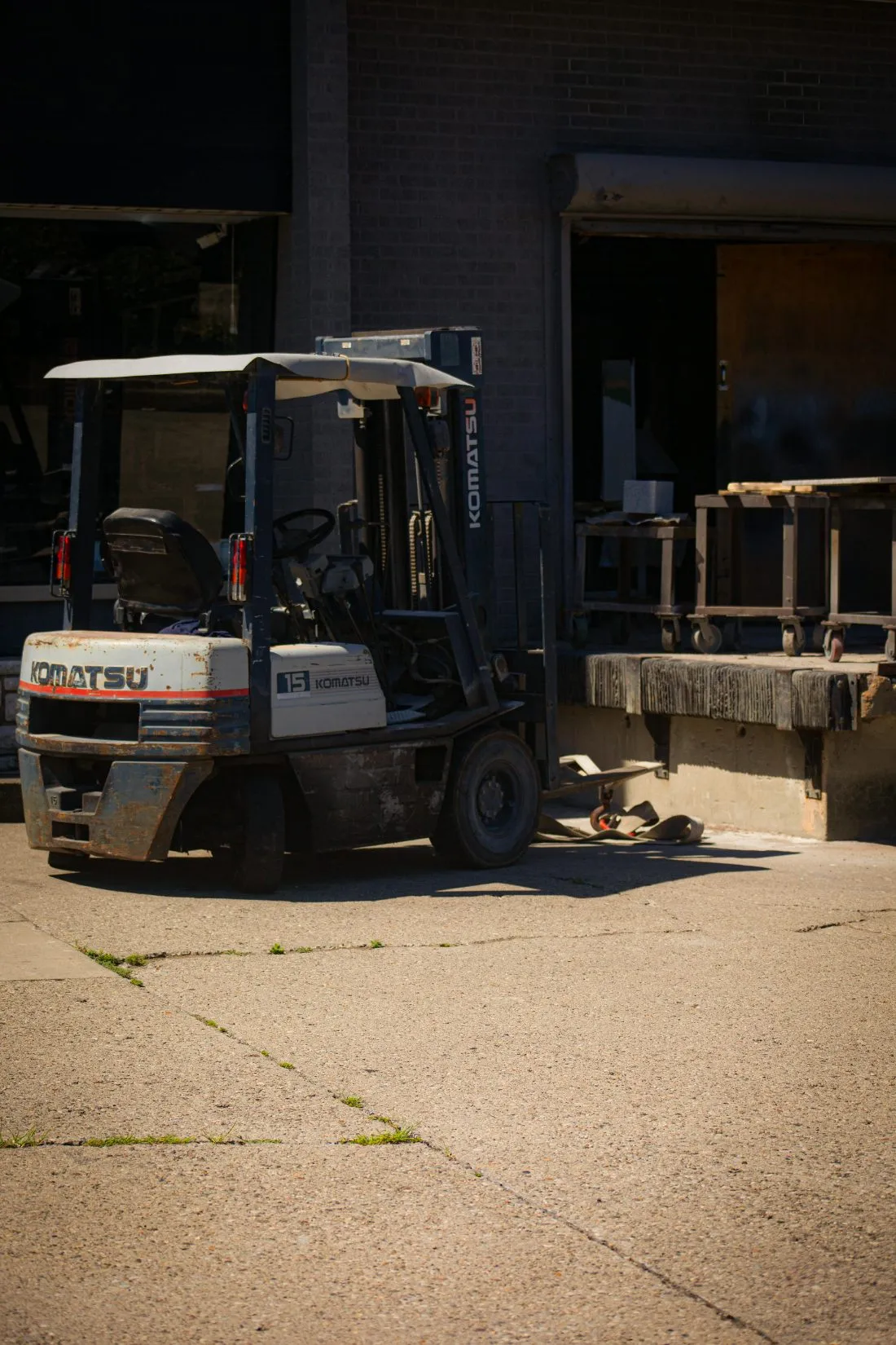 Forklift at loading dock in small warehouse operation