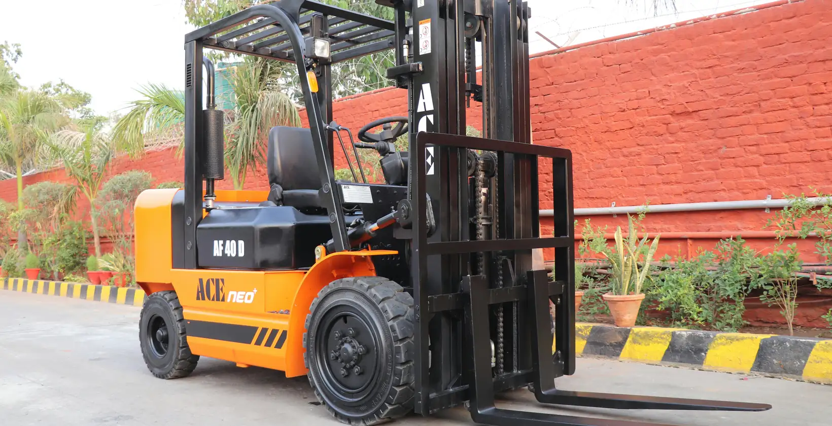 Orange diesel forklift parked outdoors ready for a short-term rental