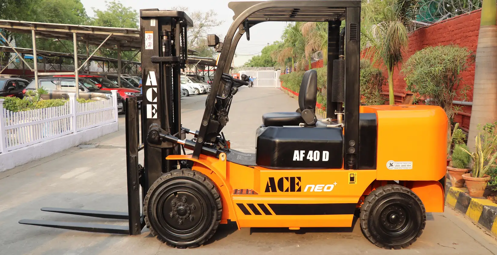 Orange diesel forklift parked at a dealer lot
